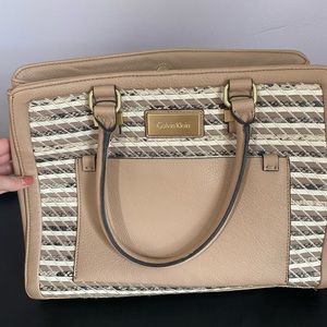 Brand new without tags CK purse. Definitely fits laptop.